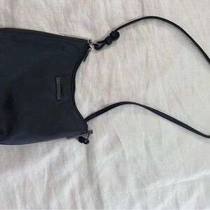 Reaction Kenneth Cole purse gunmetal black/dark grey. Thick nylon-like material.